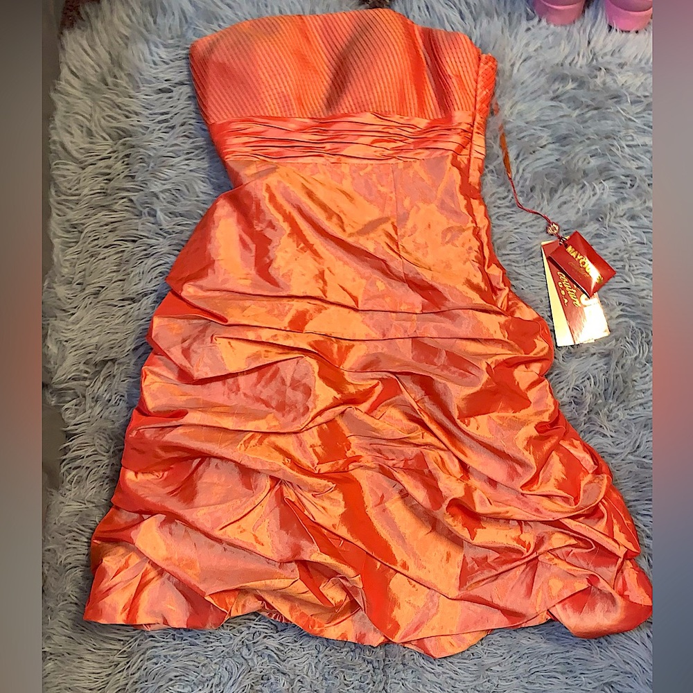 May Queen orange strapless formal elegant dress.